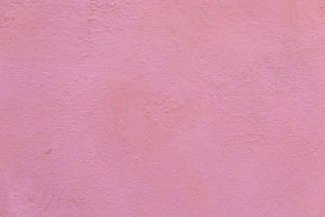 painted pink plaster wall of an old house in the provence