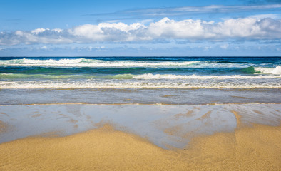 Tropical sandy beach and sea of Atlantic ocean in Spain.
