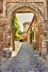 Fototapeta na wymiar Old main gate to the medieval village of Ostia Antica - Rome, Italy