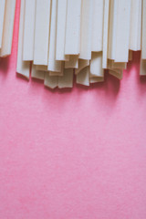 Asian udon noodles on a bright pink background. Macro. Flat lay. Minimalism.