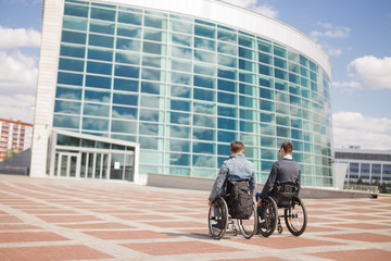 Disabled Happy friends having fun together outside.