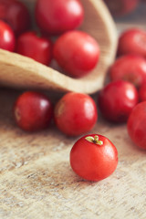 Closeup of fresh ripe cranberries on wooden background