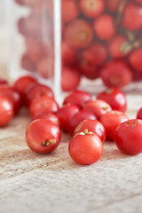 Closeup of fresh ripe cranberries on wooden background