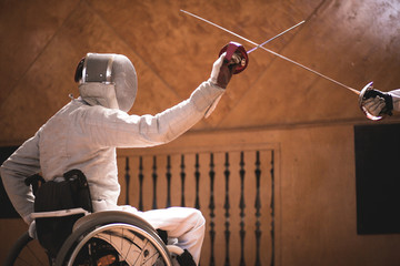 training disabled fencers sitting on a wheelchair