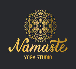 Hand lettering gold logo with mandala elements for yoga studio. Isolated on black background. Vector illustration.