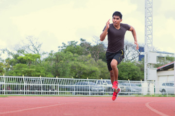 Young runners are jogging on the treadmill and are happy.