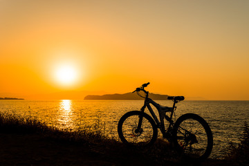 Picture of bicycle on the sunset sea overview