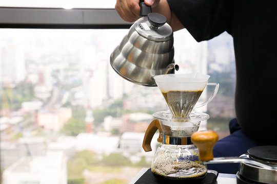 Hand Drip Coffee, Barista Pouring Water On Coffee Ground With Filter In Office