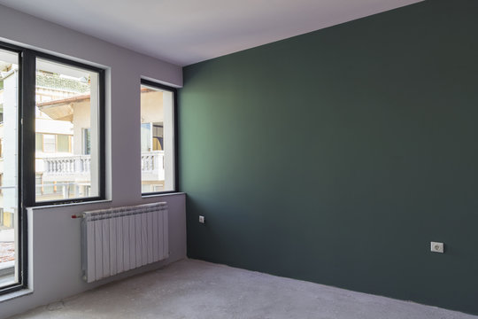 Unfinished interior of apartment  under construction. Dark Green