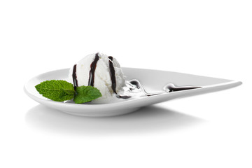Plate with delicious ice-cream and chocolate sauce on white background