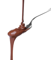 Delicious chocolate sauce pouring into spoon on white background