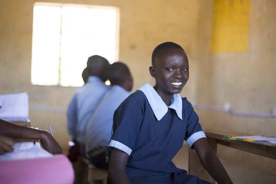 Portrait of school girl in classroom. Kenya, Africa.