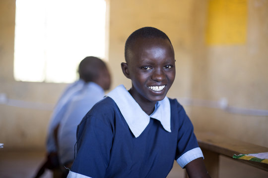 Portrait of smiling school girl in classroom