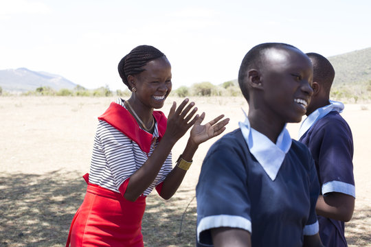 Teacher with school children outdoors. Kenya, Africa.