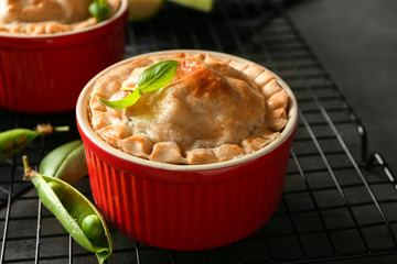 Baking cup with delicious turkey pie on grid