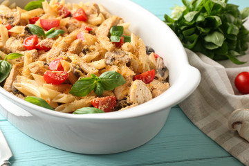 Baking dish with delicious turkey tetrazzini on table, closeup