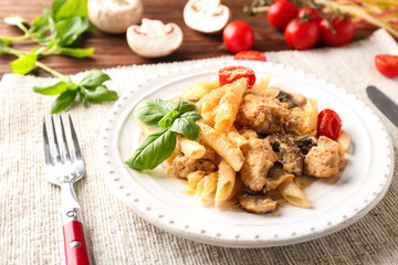 Plate with delicious turkey tetrazzini on table