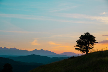 Mountains landscape under morning sky with clouds