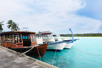 Fototapeta na wymiar Boats berthed at tropical resort