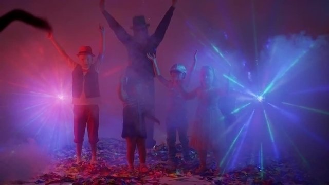 Children and funny man having fun at disco party