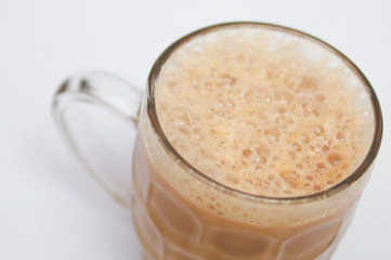 Close Up Tea With Milk Or Popularly Known As Teh Tarik Over White Background