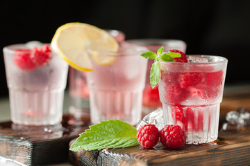 Red refreshing cocktail with raspberry and mint