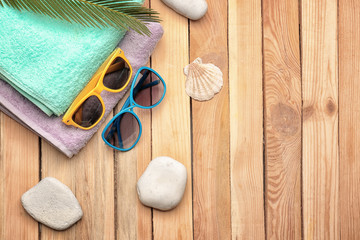 Beach accessories on wooden background. Vacation concept
