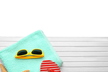 Beach accessories on wooden board. Vacation concept