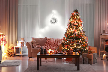 Decorated living room with beautiful Christmas tree