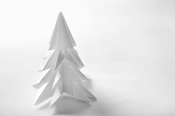 Christmas tree made of paper on white background