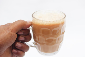 Hand Holding A Glass Of Hot Tea With Milk Also Known As Teh Tarik