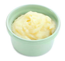 Ramekin with mashed potatoes on white background