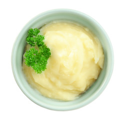 Ramekin with mashed potatoes on white background