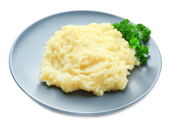 Plate with mashed potatoes on white background