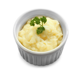 Ramekin with mashed potatoes on white background