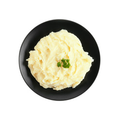 Black plate with mashed potatoes on white background