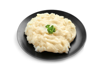 Black plate with mashed potatoes on white background