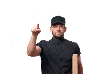 Delivery man with cardboard box is ringing the door bell