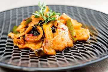 wok fried chicken stir fry with sweet peppers and chinese vegetables