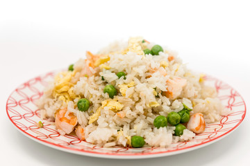 Homemade Chinese fried rice with vegetables and fried eggs