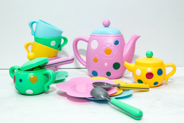 Kids tea coffee serving set, colorful cups, saucers, spoons, teapot, sugar bowl, creamer