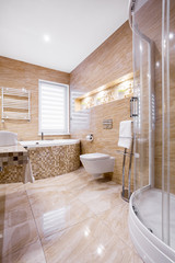 Sandstone bathroom with bath