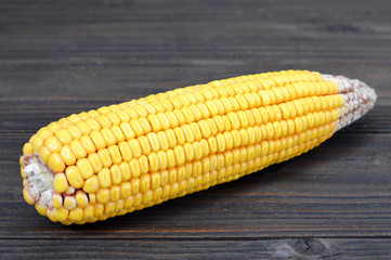 Corn cob  on wooden background