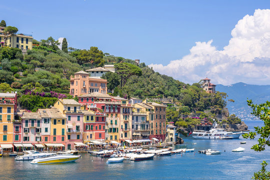 Beautiful daylight view to Portofino streets and ships on water. Italy beauties.