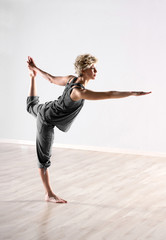 Young woman practising body balance