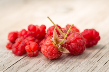 Red Ripe Raspberries On Wood Table