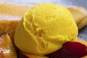 Peach and mango sorbet scoop closeup