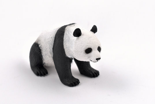 Fototapeta Panda figurine toy stock photo images. Panda toy isolated on a white background. Statuette sitting panda images