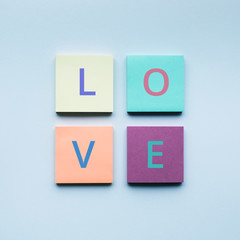 Love text on colorful notepaper.