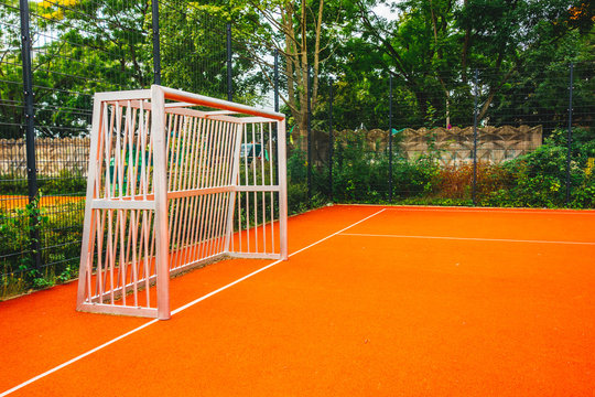 steel soccer goal on orange field